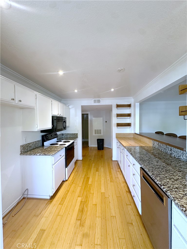 Kitchen opens to dining room for entertaining - 70 Corniche, Dana Point CA 92629 - photo 9