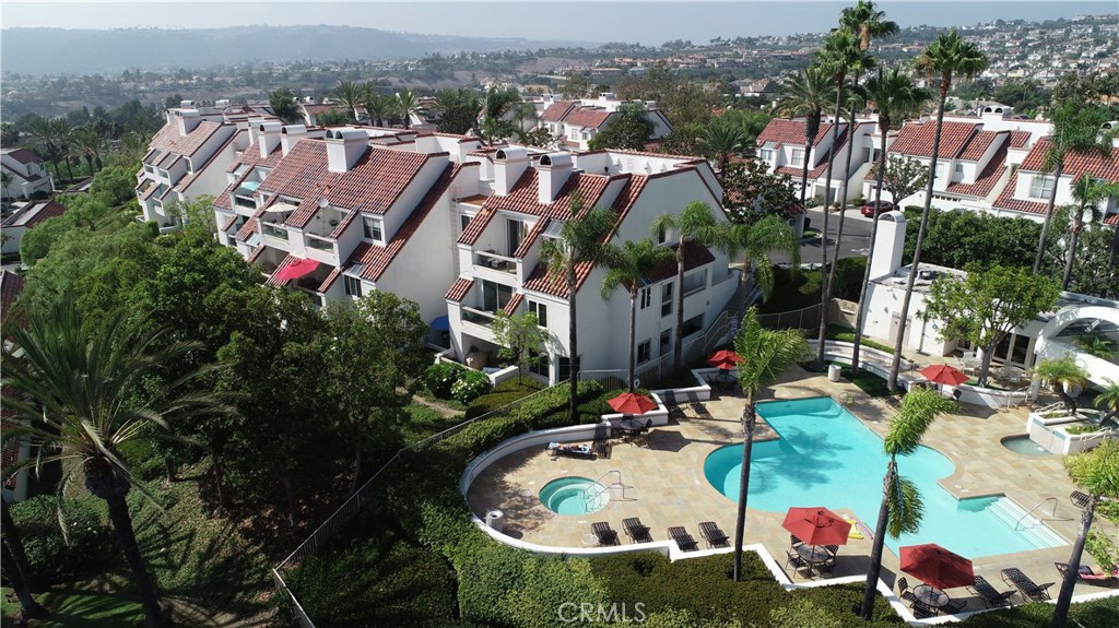 Beautiful community pool, clubhouse and jacuzzi with an OCEAN VIEW. 76 Los Cabos is located in the building next to the - 76 Los Cabos, Dana Point CA 92629 - photo 1