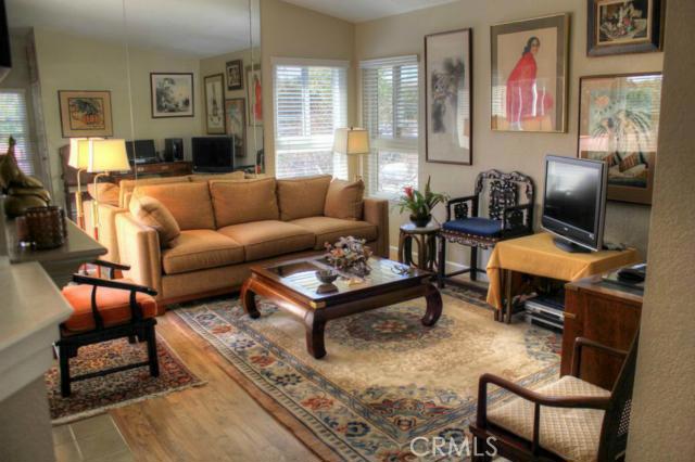 Formal living room with pergo wood floors, high ceilings, holds lots of art. Milgard double pane windows, slider to balc - 8 CORNICHE Drive E, Dana Point CA 92629 - photo 1