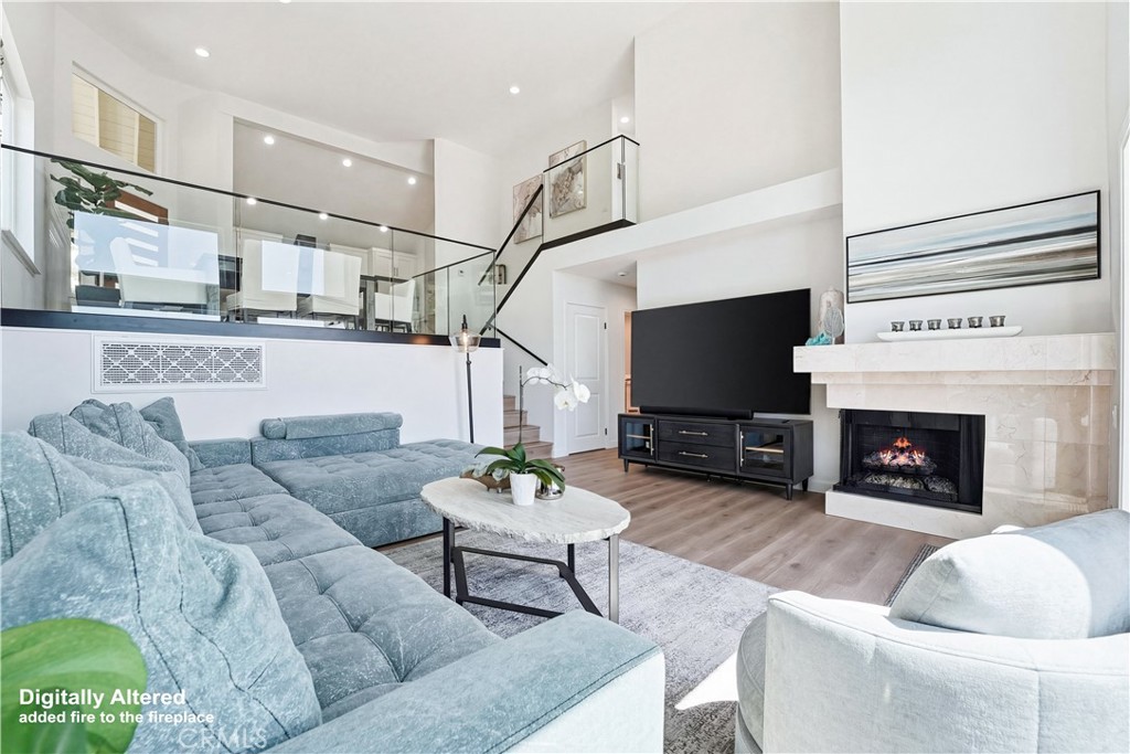 Large great room with fireplace and french doors to expansive yard - 83 Palm Beach Court, Dana Point CA 92629 - photo 16
