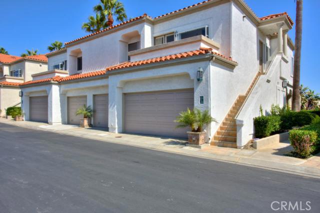 Spacious garage for cars and extra storage. Allows easy access into home. - 98 Tennis Villas Drive, Dana Point CA 92629 - photo 1