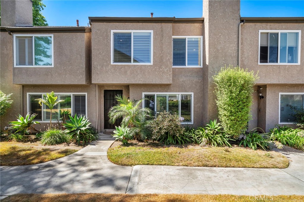 Stunning, masterfully upgraded 3-bedroom townhome, zoned as a Single Family Residence/PUD - 10853 Poly Court, Fountain Valley CA 92708 - photo 1