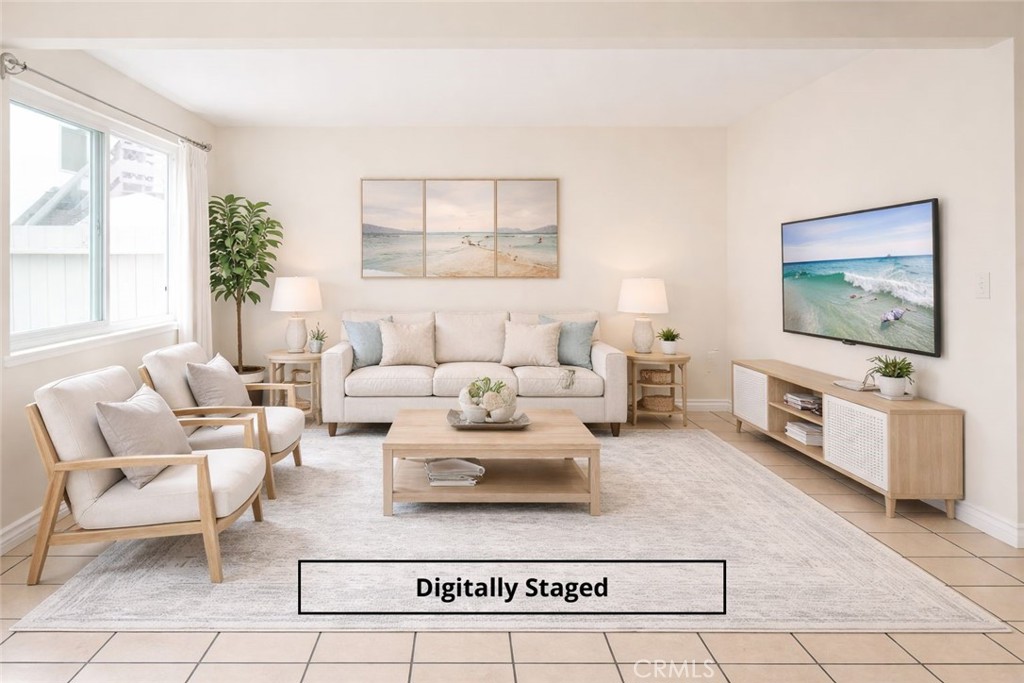 Experience the ultimate in open-concept living with this beautifully curated, digitally staged living room. - 11115 Slater A, Fountain Valley CA 92708 - photo 1