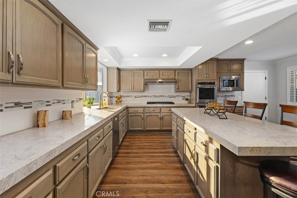 Beautifully remodeled kitchen with quartz countertops. - 16550 Redwood, Fountain Valley CA 92708 - photo 1