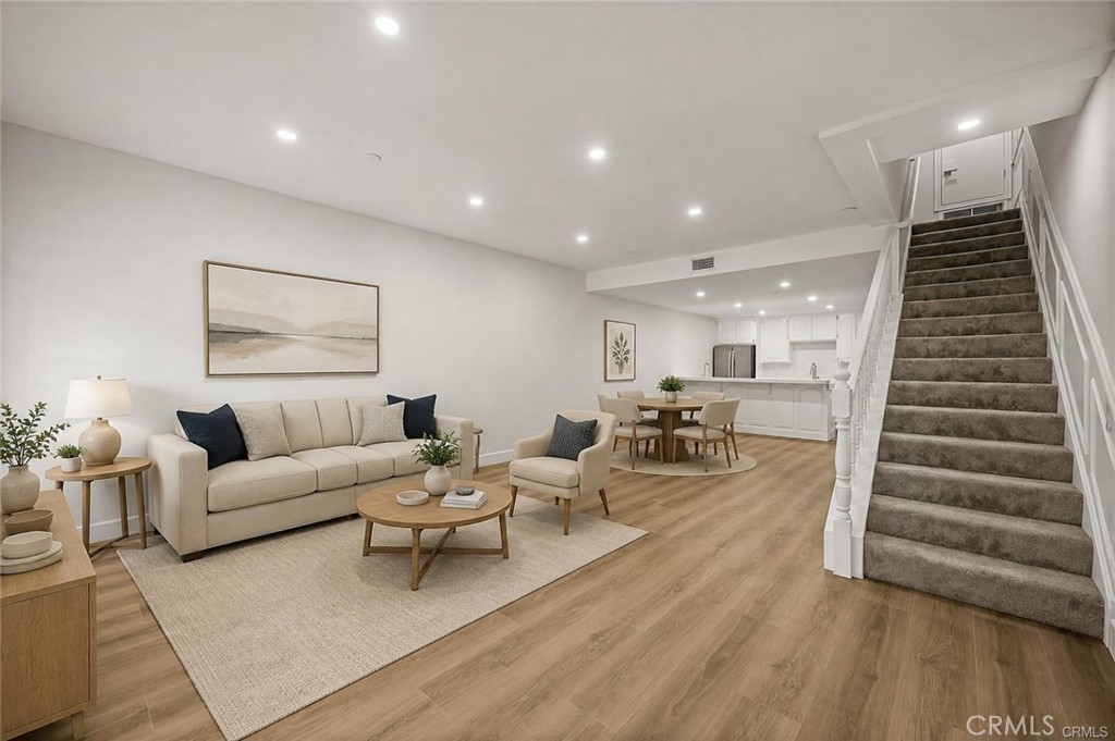 Luxurious living/dining room. Upgraded with new LVT floors and new carpet - 17200 Newhope 31, Fountain Valley CA 92708 - photo 2
