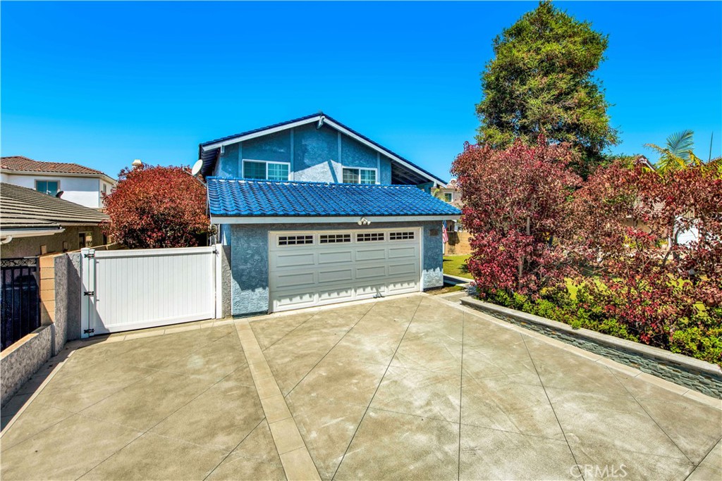 Extra large driveway allows storage of your RV and is helpful in a multi vehicle household - 17455 Winemast Street, Fountain Valley CA 92708 - photo 4