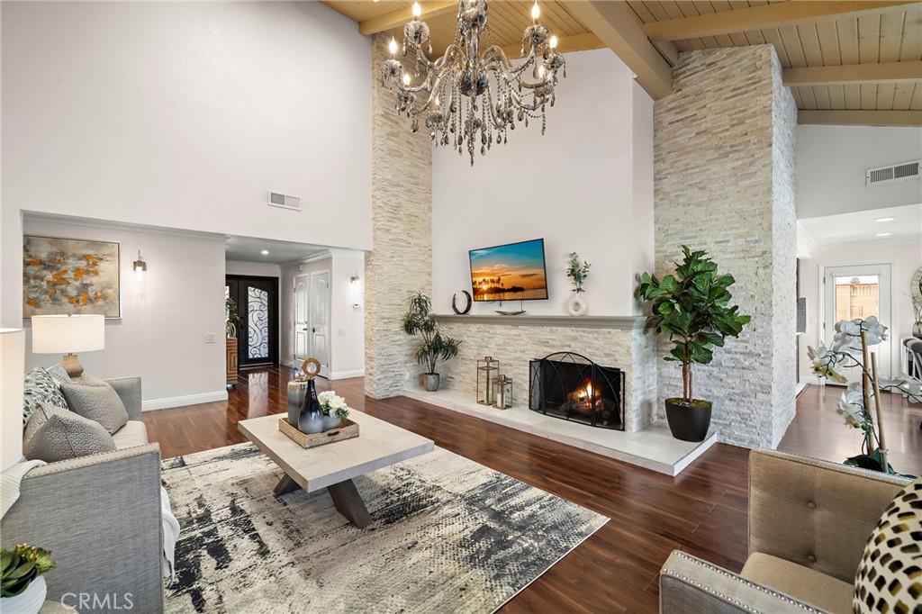 Floor to ceilings stack-stone fireplace feature - 17925 Mount Coulter, Fountain Valley CA 92708 - photo 6