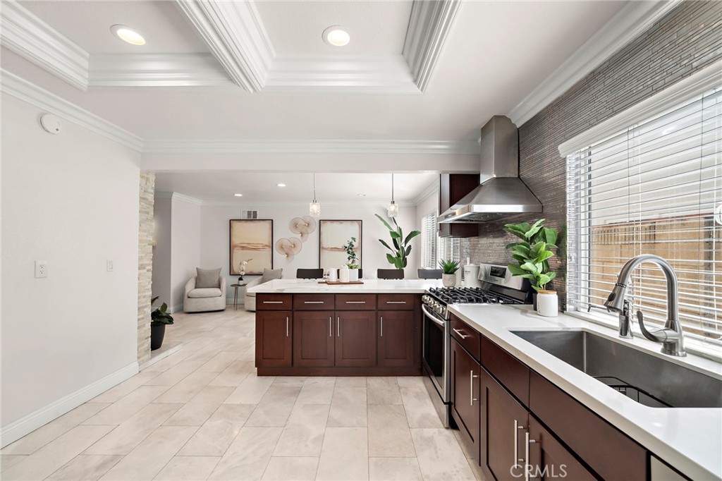 Spacious kitchen features rich wood cabinetry with soft-close drawers - 17925 Mount Coulter, Fountain Valley CA 92708 - photo 10
