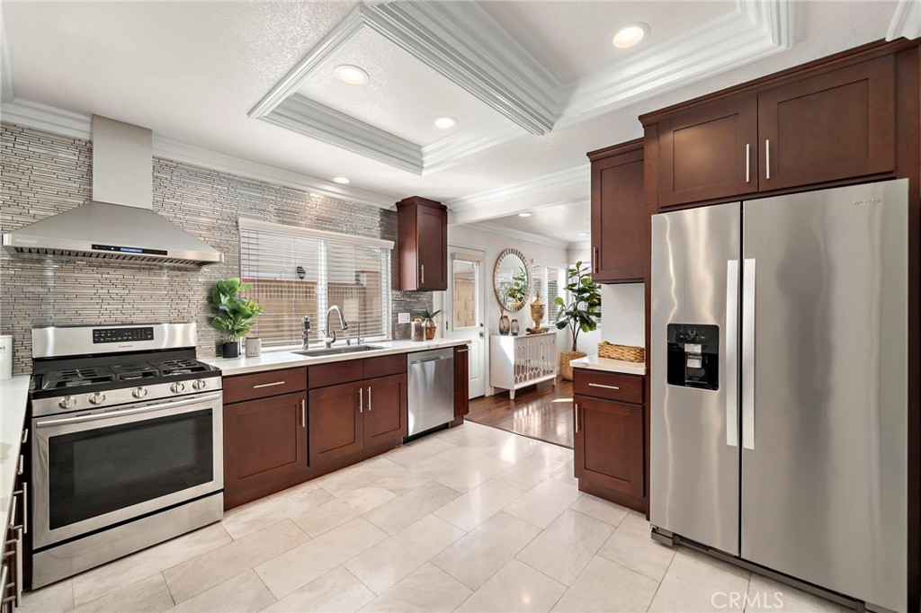 Pendant lighting, a gas range, walk-in pantry - 17925 Mount Coulter, Fountain Valley CA 92708 - photo 11