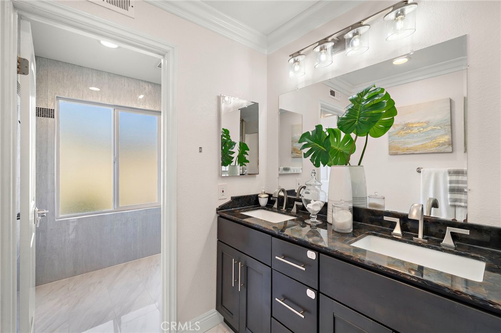 Primary bath with dual sinks and separate shower/toilet area - 17925 Mount Coulter, Fountain Valley CA 92708 - photo 20