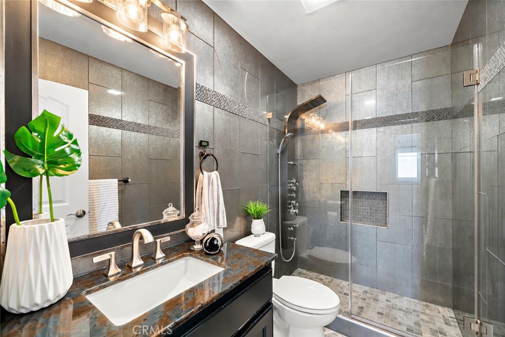 Upgraded hall bath with glass enclosed walk-in shower - 17925 Mount Coulter, Fountain Valley CA 92708 - photo 26