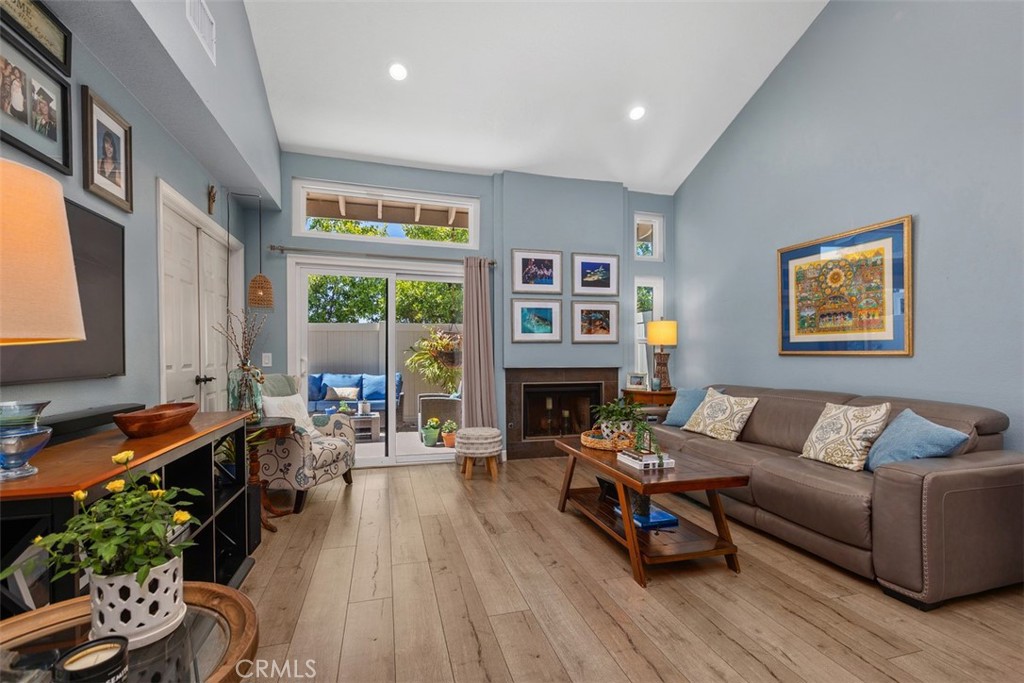 Different view of living room with high ceilings and leads to patio - 18261 Sanmian Court, Fountain Valley CA 92708 - photo 5