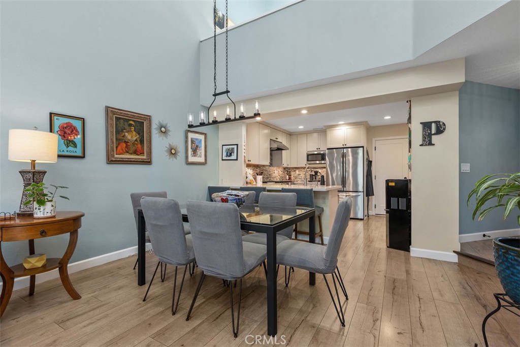 Dining area next to kitchen with custom light fixture - 18261 Sanmian Court, Fountain Valley CA 92708 - photo 8