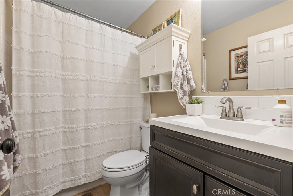 Upstairs bathroom with shower in tub - 18261 Sanmian Court, Fountain Valley CA 92708 - photo 22