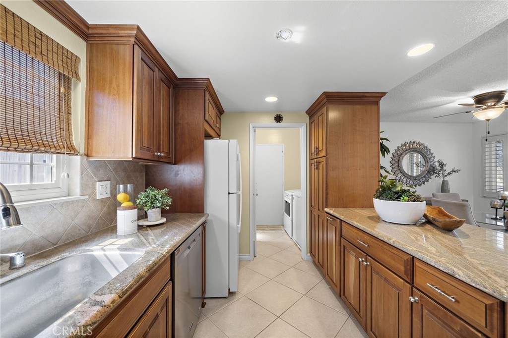 Microwave, ample storage, and generous prep space - 18474 Tamarind Street, Fountain Valley CA 92708 - photo 5