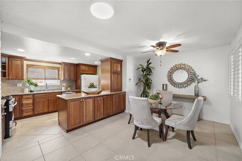 Dining room flows seamlessly into gourmet kitchen - 18474 Tamarind Street, Fountain Valley CA 92708 - photo 8