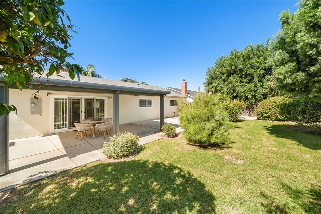 Spacious backyard is enhanced by mature fruit trees, including grapefruit, pomegranate, and lime - 18474 Tamarind Street, Fountain Valley CA 92708 - photo 27