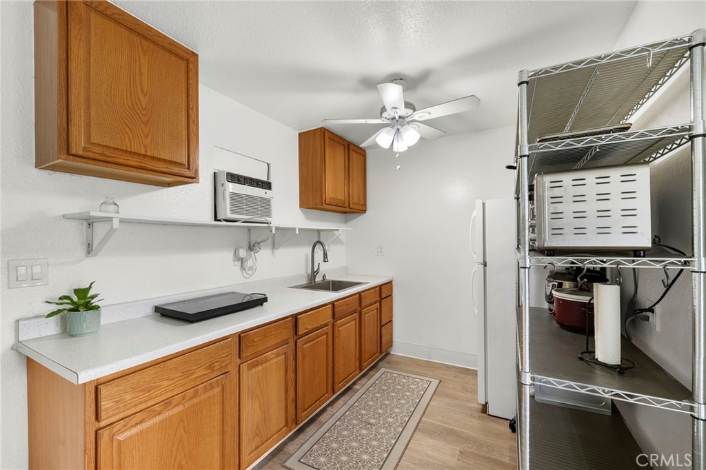Kitchen with hot plate, microwave, portable oven, refrigerator, air fryer - 18569 San Marcos, Fountain Valley CA 92708 - photo 4