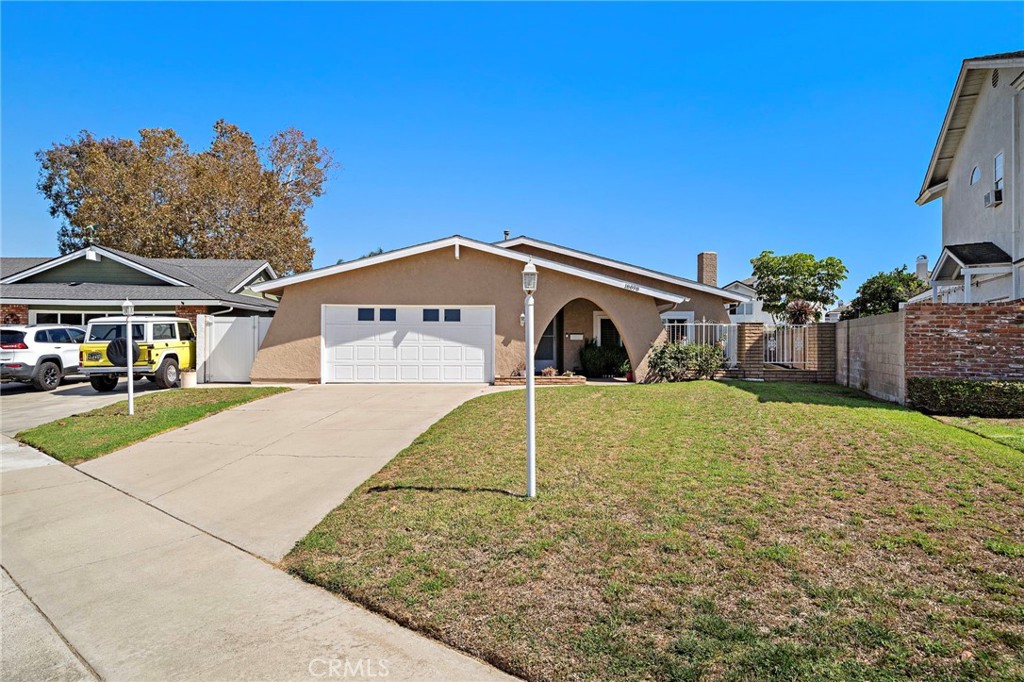 an additional approximately 256 sq ft enclosed patio, on a 7,700 sq ft lot - 18898 Persimmon Circle, Fountain Valley CA 92708 - photo 2