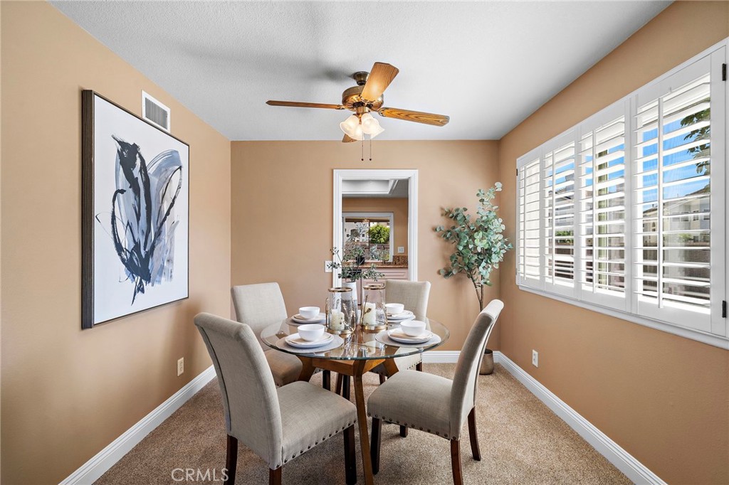shutters in the dining room - 18898 Persimmon Circle, Fountain Valley CA 92708 - photo 8