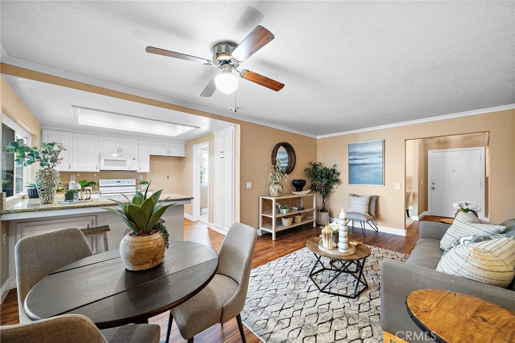 kitchen opens to family - 18898 Persimmon Circle, Fountain Valley CA 92708 - photo 13