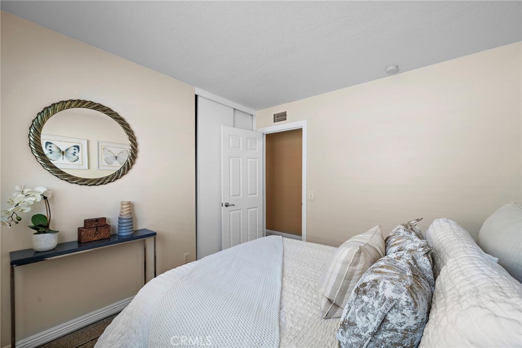 1 of 4 bedrooms newer carpet and fresh paint - 18898 Persimmon Circle, Fountain Valley CA 92708 - photo 16