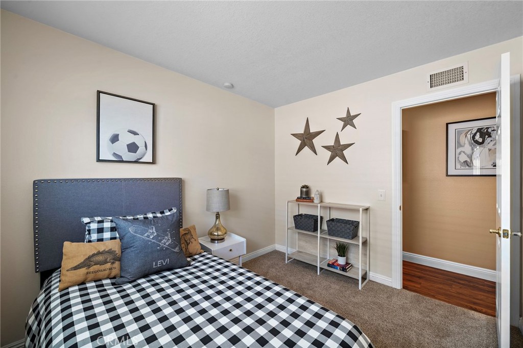 2 of 4 bedrooms newer carpet and fresh paint - 18898 Persimmon Circle, Fountain Valley CA 92708 - photo 18