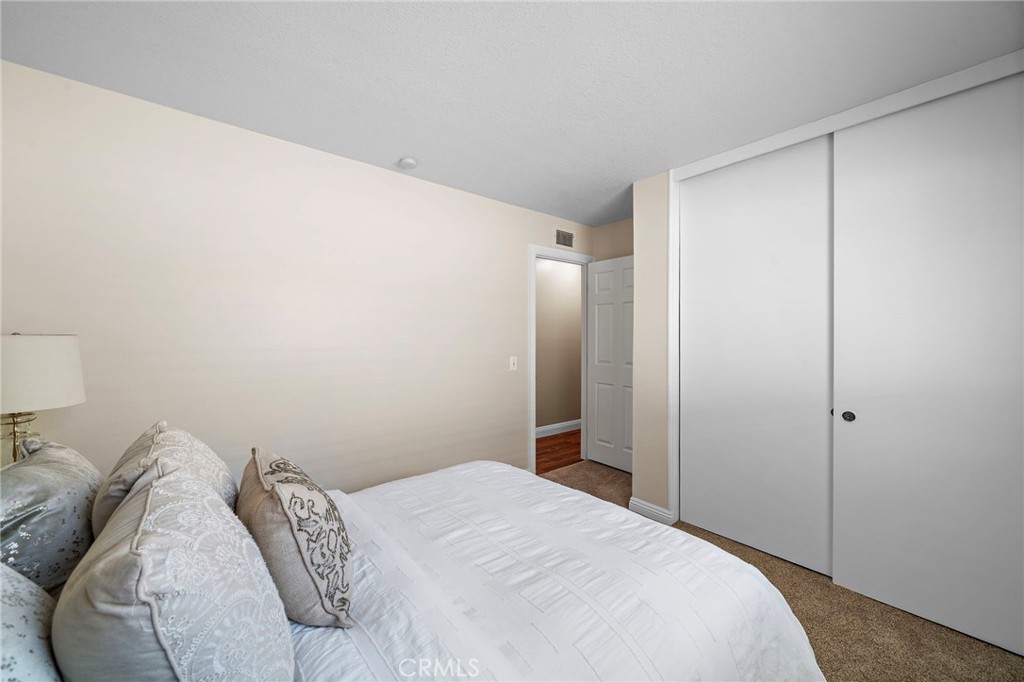 1 of 4 bedrooms newer carpet and fresh paint - 18898 Persimmon Circle, Fountain Valley CA 92708 - photo 20