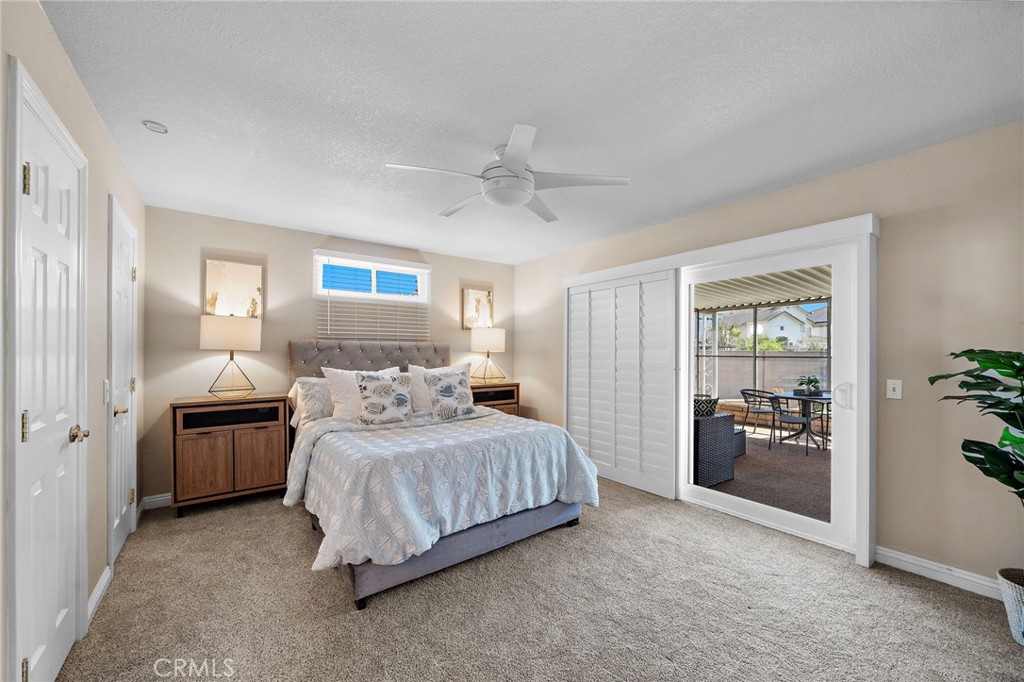primary suite with direct access to enclosed patio - 18898 Persimmon Circle, Fountain Valley CA 92708 - photo 22