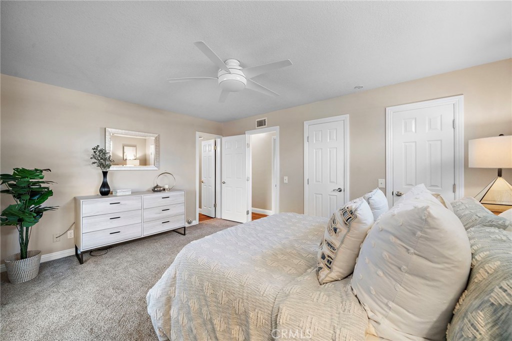 primary suite with dual door walk in closet - 18898 Persimmon Circle, Fountain Valley CA 92708 - photo 23