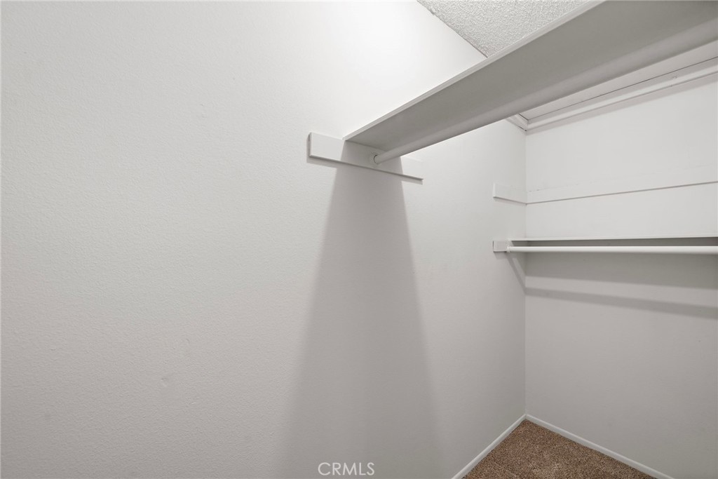 walk in closet - 18898 Persimmon Circle, Fountain Valley CA 92708 - photo 24