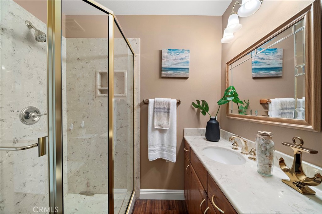 ensuite bathroom with beautiful gold fixtures - 18898 Persimmon Circle, Fountain Valley CA 92708 - photo 25