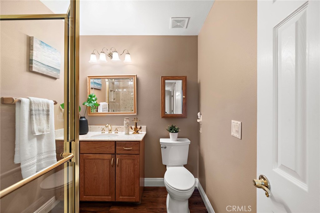 ensuite bath with walk in shower - 18898 Persimmon Circle, Fountain Valley CA 92708 - photo 26