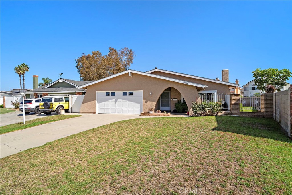 distinctive arched covered entry - 18898 Persimmon Circle, Fountain Valley CA 92708 - photo 36
