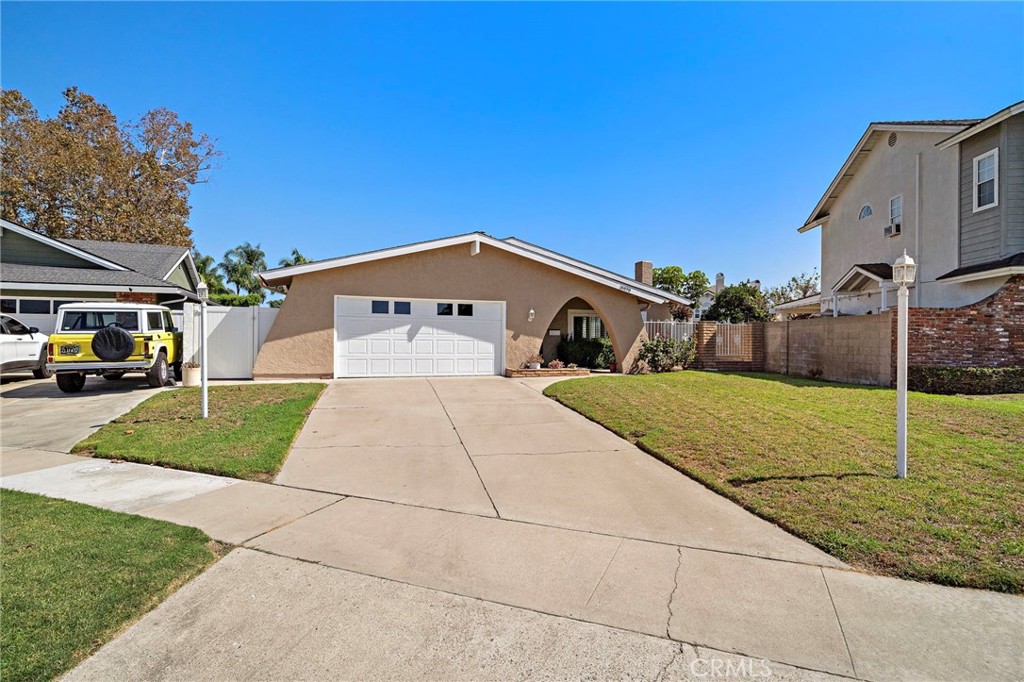 expansive front lawn, mature landscaping - 18898 Persimmon Circle, Fountain Valley CA 92708 - photo 37