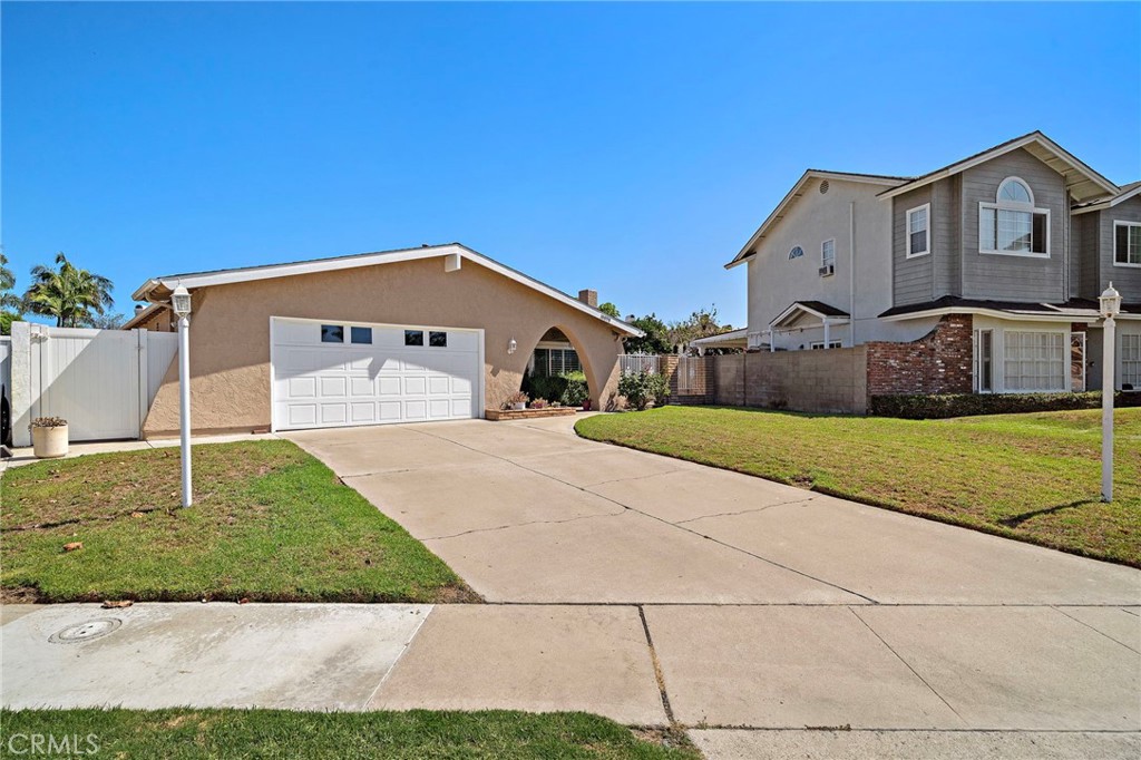 two-car garage - 18898 Persimmon Circle, Fountain Valley CA 92708 - photo 38