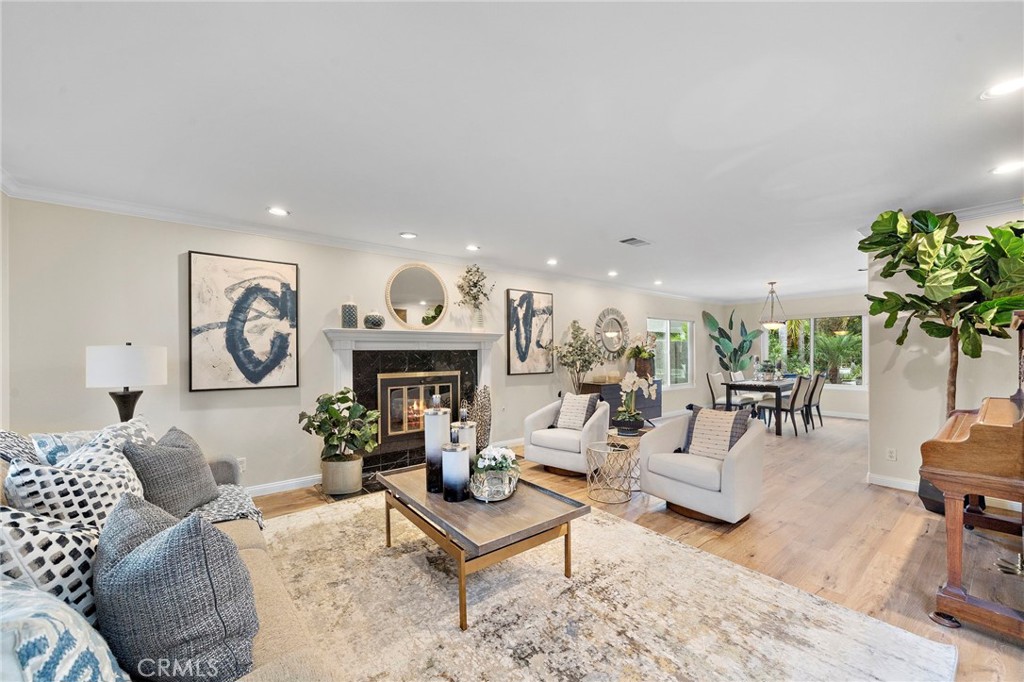 Formal Living Room with Bay Window, Window Seat, and Granite Fireplace with Custom Surround and Mantel - 8566 Phoenix Avenue, Fountain Valley CA 92708 - photo 3