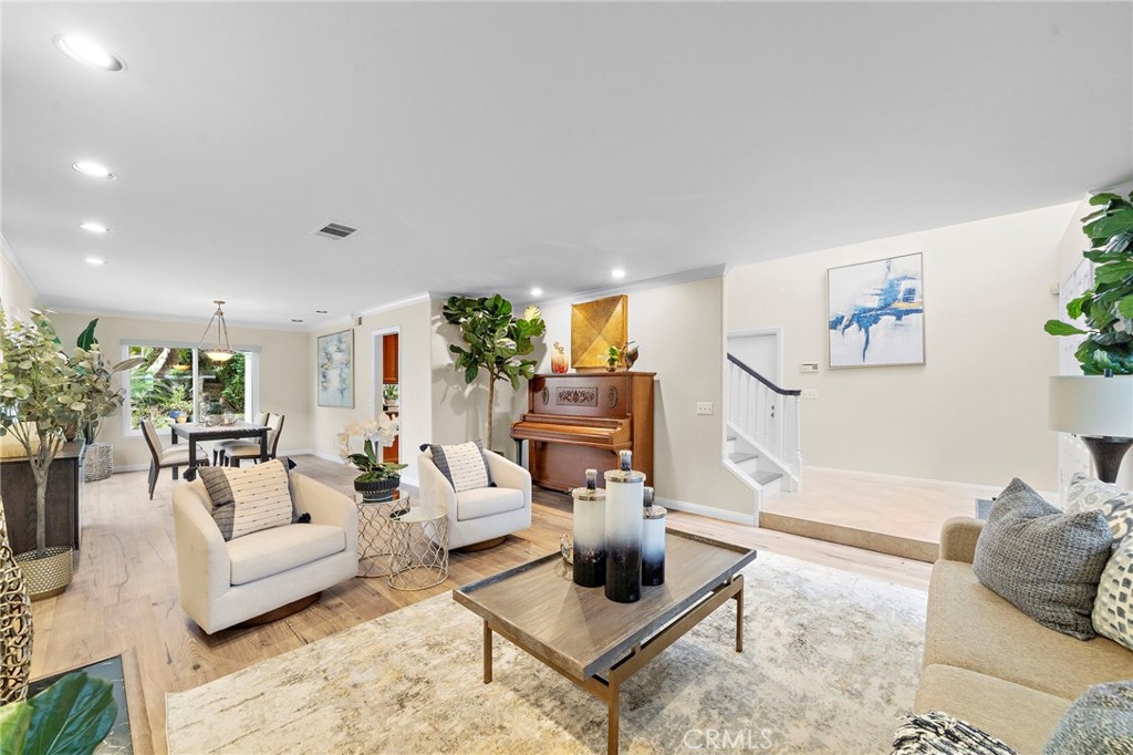 Formal living room opens up to dining room with view of the beautiful backyard - 8566 Phoenix Avenue, Fountain Valley CA 92708 - photo 6
