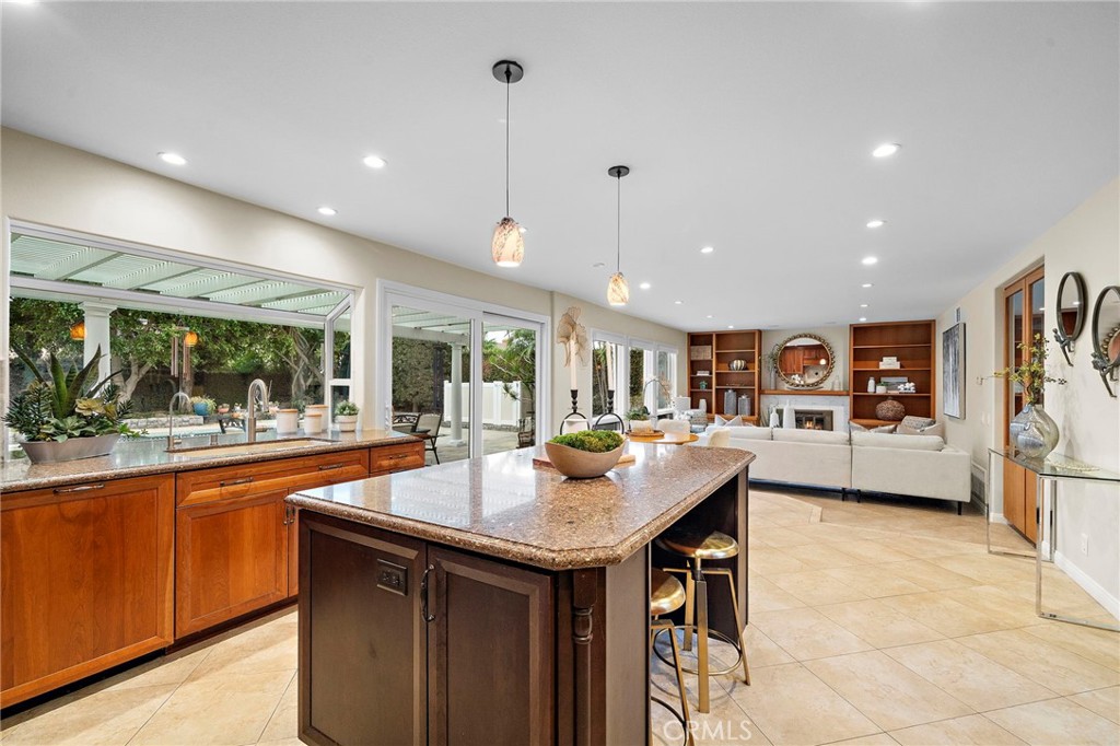 Features center island w/ eat at breakfast bar - 8566 Phoenix Avenue, Fountain Valley CA 92708 - photo 11