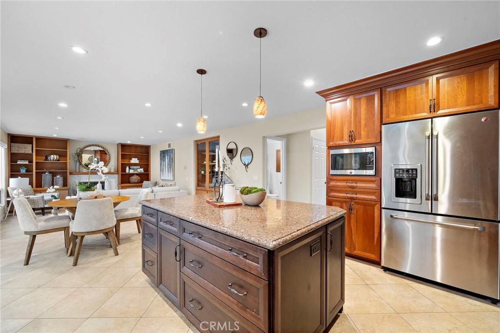 Kitchen opens up to breakfast nook and family room - 8566 Phoenix Avenue, Fountain Valley CA 92708 - photo 12