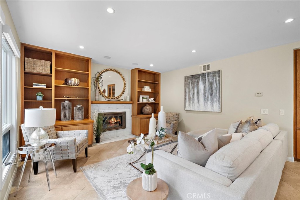 Inviting family room with marble fireplace - 8566 Phoenix Avenue, Fountain Valley CA 92708 - photo 20