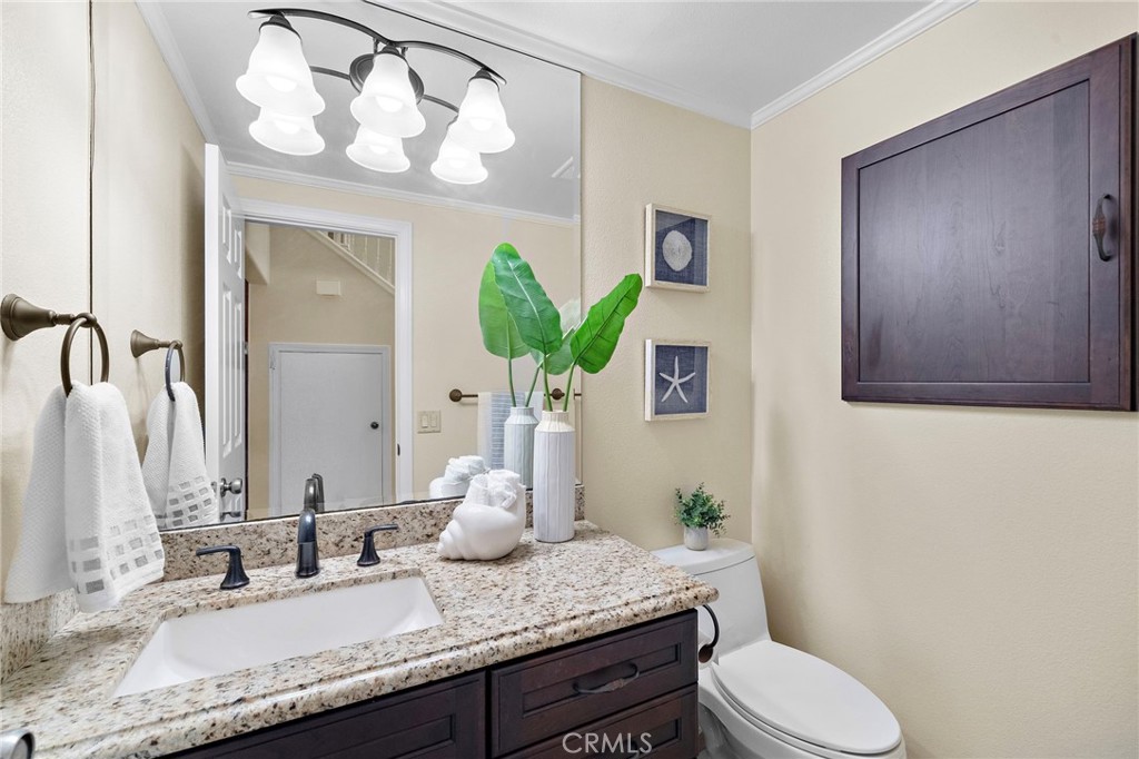 Downstairs half bathroom - 8566 Phoenix Avenue, Fountain Valley CA 92708 - photo 22