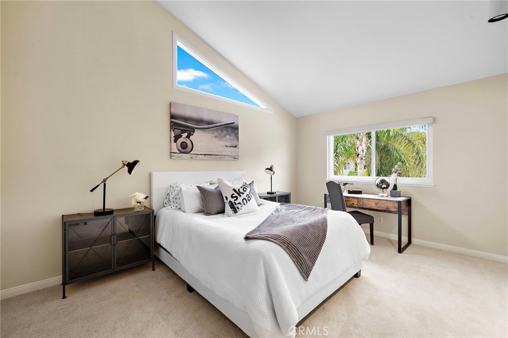 Bedroom 3 vaulted ceilings and organized walk-in closet - 8566 Phoenix Avenue, Fountain Valley CA 92708 - photo 36