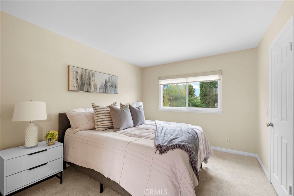 Bedroom 4 vaulted ceilings and organized walk-in closets - 8566 Phoenix Avenue, Fountain Valley CA 92708 - photo 38