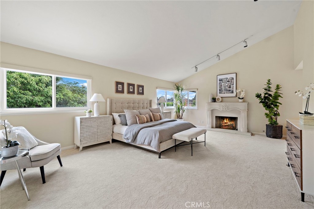Expanded primary suite w/ romantic stone fireplace - 8566 Phoenix Avenue, Fountain Valley CA 92708 - photo 23