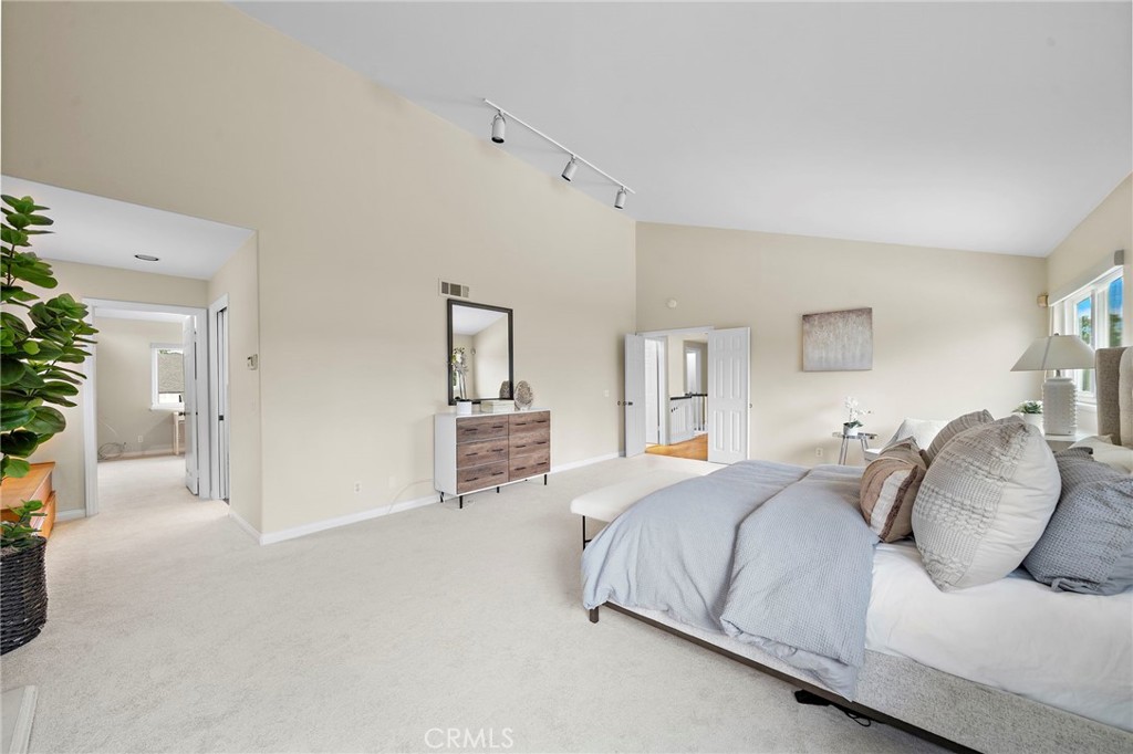 a luxurious private sanctuary with soaring vaulted ceilings. - 8566 Phoenix Avenue, Fountain Valley CA 92708 - photo 24