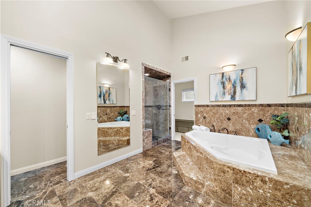 Deep soaking tub, oversized marble shower with bench - 8566 Phoenix Avenue, Fountain Valley CA 92708 - photo 30