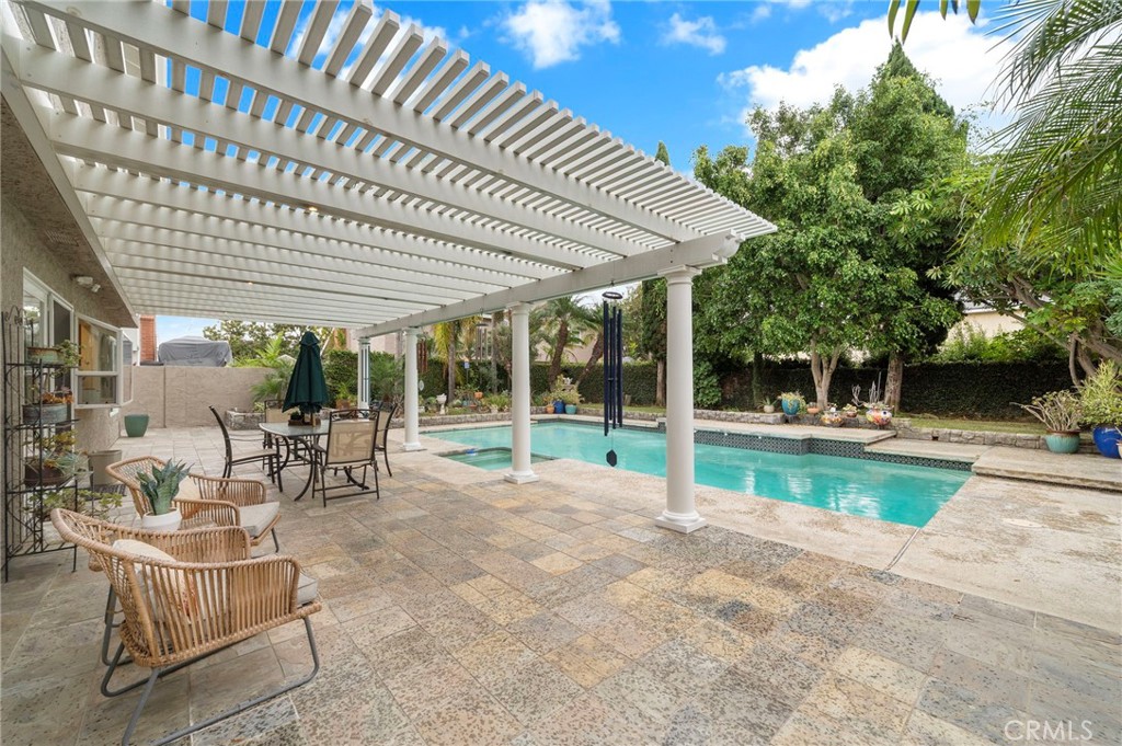 tep outside to your own tropical paradise featuring a sparkling pool and spa - 8566 Phoenix Avenue, Fountain Valley CA 92708 - photo 40