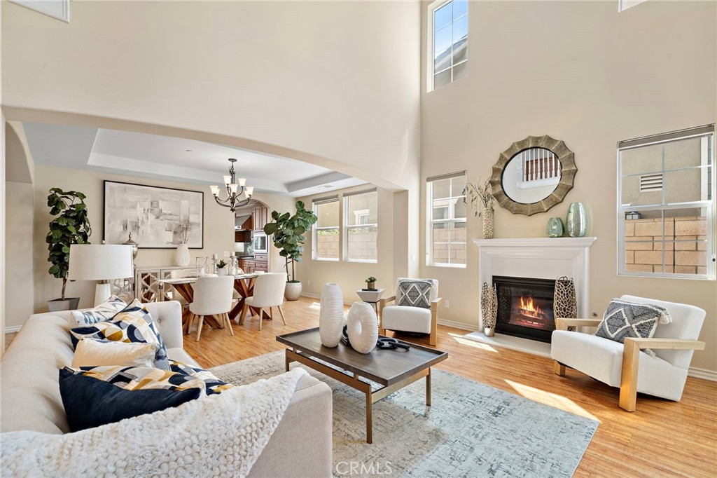 Living room high ceiling and formal dining room in the back - 9042 Lemongrass Court, Fountain Valley CA 92708 - photo 8