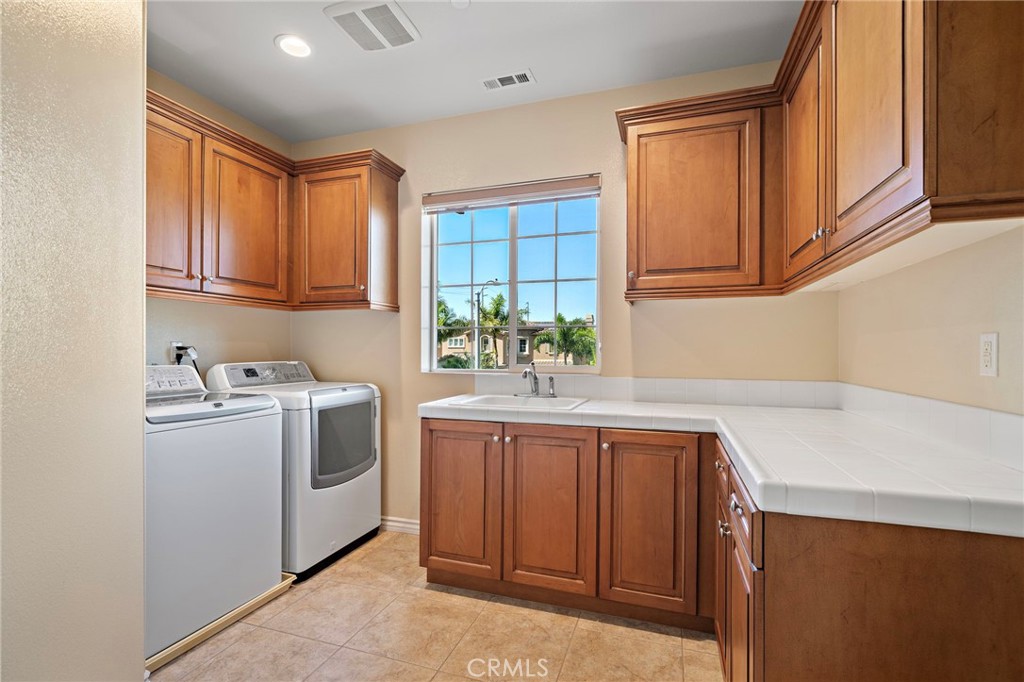 Laundry room in the 2nd floor - 9042 Lemongrass Court, Fountain Valley CA 92708 - photo 30